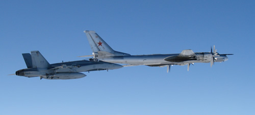  CF-18 Hornet from 4 Wing Cold Lake flies next to a Russian Tu-95 Bear bomber on September 5, 2007. The Canadian NORAD Region aircraft visually identified and monitored the Russian aircraft as they passed through the North American Air Defence Identification Zone (ADIZ) in international airspace. 