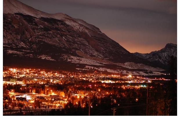 View of Canmore from the nordic centre, with the lights from Calgary in the distance.