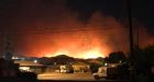 Wildfire forces thousands to flee homes north of L.A.