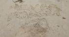 'Never forget' message written in the sand at Omaha Beach as veterans mark years since D-Day