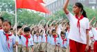 Chinese blogger detained for wearing 'holy' Communist red scarf with 'revealing' skirt in videos