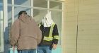 Northern Alberta RCMP investigate apparent KKK hood worn to Canada Post | CBC News