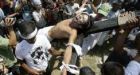 Filipinos mark Good Friday with whips and nails