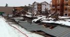 Heavy rain and melting snow topple roofs, raise river levels