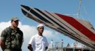 Autopsies suggest jet broke up in sky