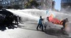 Police clash with protesters outside finance meeting in Turkey