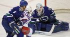 Raycroft still solid as Canucks down Rangers