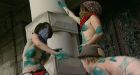 Topless women protest arts cuts outside legislature