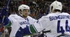 Canucks claw their way back in Columbus