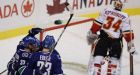 Canucks' early outburst smothers Flames