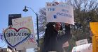 Students protest religious extremists with silly signs