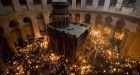 Orthodox faithful celebrate holy fire ritual