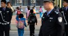 China schools reopen with guards after attacks
