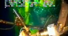 Oil gushing from broken well as BP replaces cap