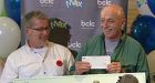 Vancouver's $50M lotto winners claim prize