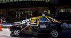 Woman plunges from 23rd floor, lands on taxi, survives