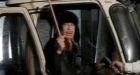 Gadhafi appears on TV to say he's still in Libya