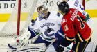Canucks head into playoffs with OT win over Flames