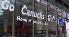 Car dealer ordered to remove Canucks signage