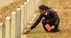 Edmonton students lay poppies on soldiers' graves