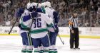 Canucks attack early, hold on to beat Kings