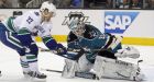 Canucks sink Sharks in OT