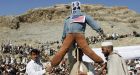 Afghan rioters lob grenades at NATO base