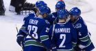 Canucks reach 50 wins, increase lead in West