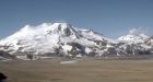 Ice-coated helicopter stranded on Alaska volcano
