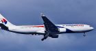 Malaysia flight's co-pilot tried to make cellphone call-report