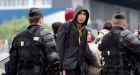 French riot police evacuate Calais immigrant camps
