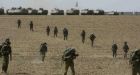 Israeli troops raid rocket-launching sites in Gaza as residents are urged to evacuate