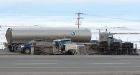Gas tanker rolls over on highway near Calgary, spilling 25,000 litres into wetlands