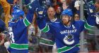 Canucks hold off Flames to avoid elimination