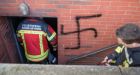 Refugee admits to swastika arson attack
