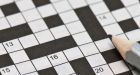 91-year-old woman fills in crossword at museum