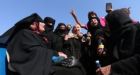Women burn burkas as Islamic State flee city of Manbij